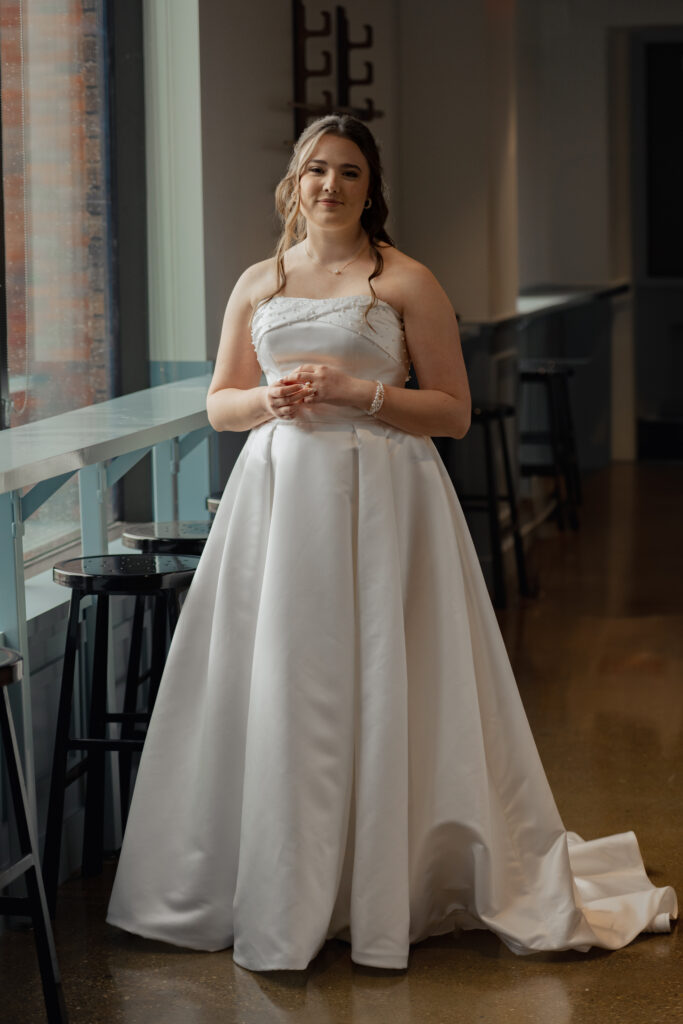 A bridal portrait of a catholic girl wearing a wedding dress ahead of her wedding ceremony.