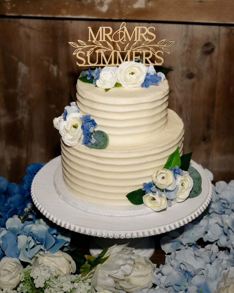 A flash photo of a wedding cake at a catholic wedding reception.
