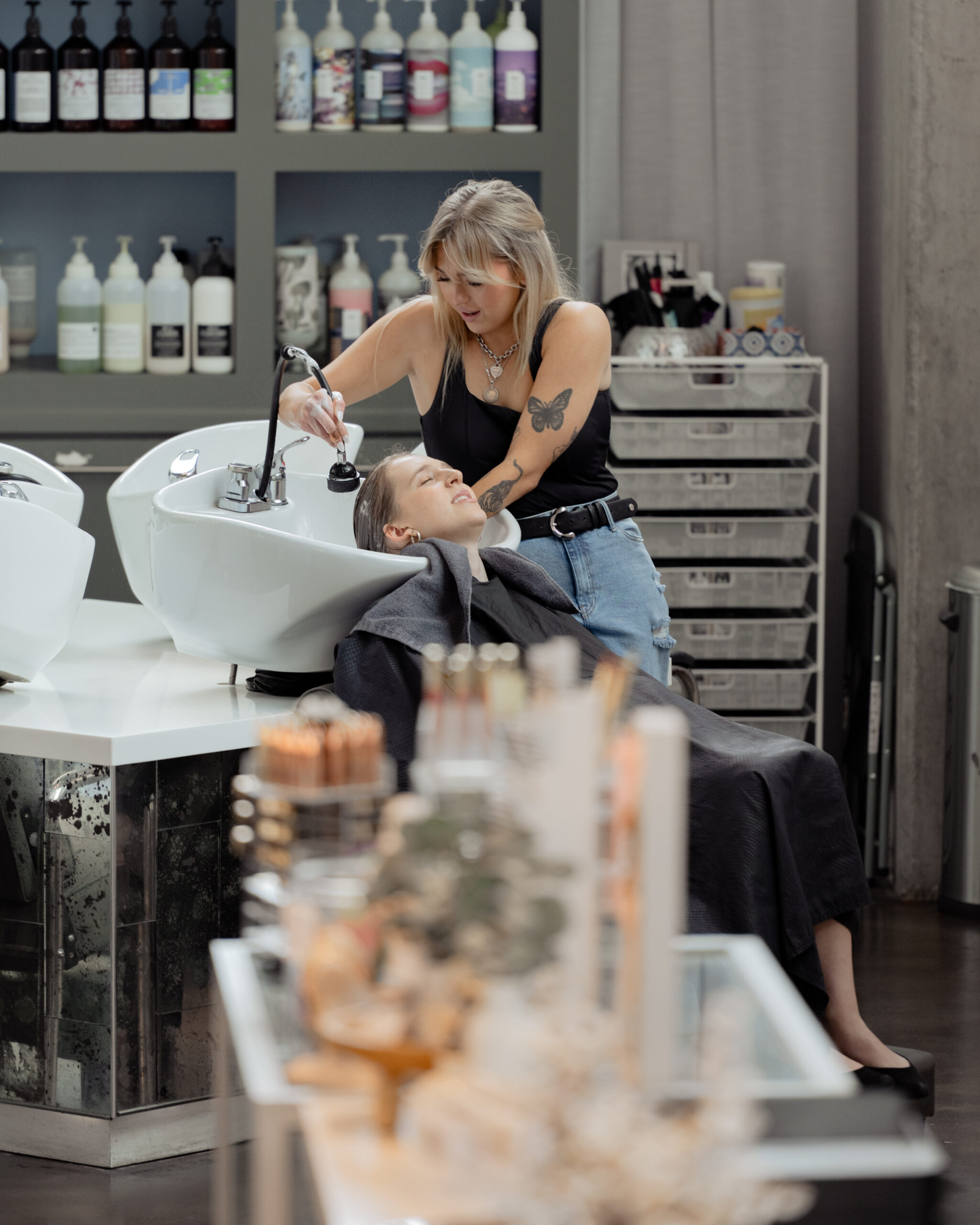 A catholic bridesmaid gets her hair washed at the Blowout Co. in the Gulch in Nashville.
