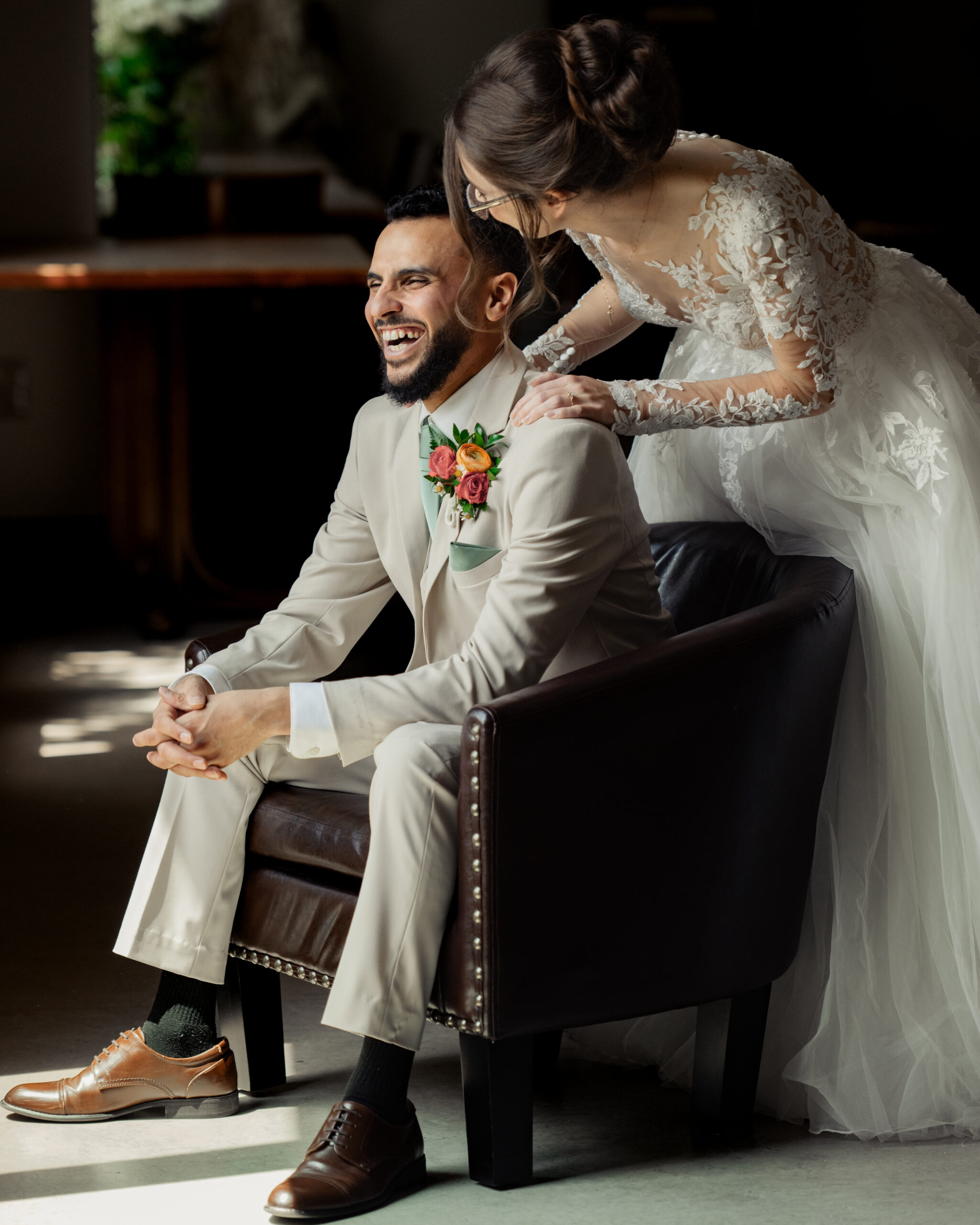 A bride and groom share an intimate moment during their first look at Holy Family catholic church in Nashville ahead of their catholic wedding Mass.