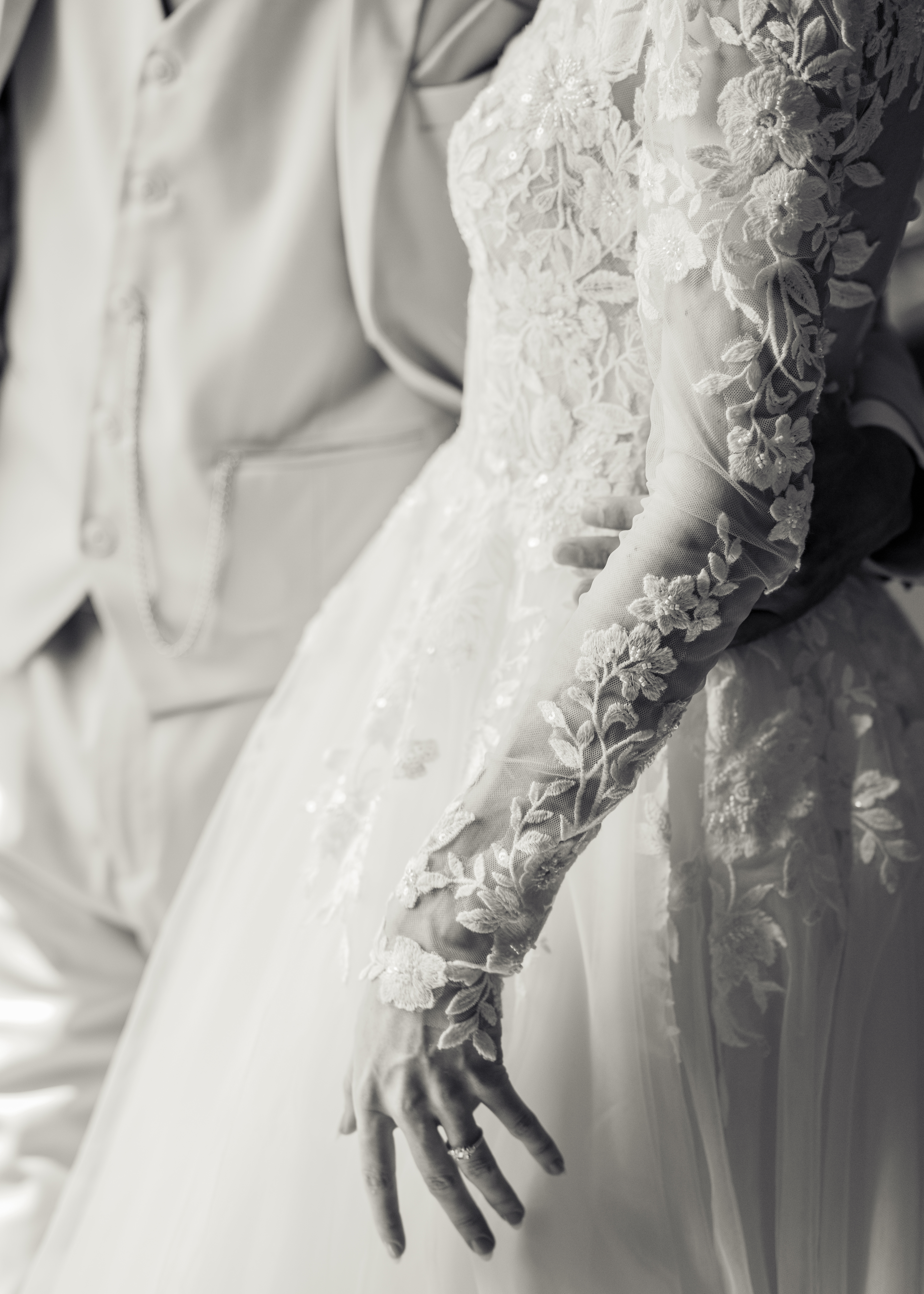 a black and white close up of a bride and groom sharing an intimate moment during their first look at Holy Family catholic church in Nashville ahead of their catholic wedding Mass.