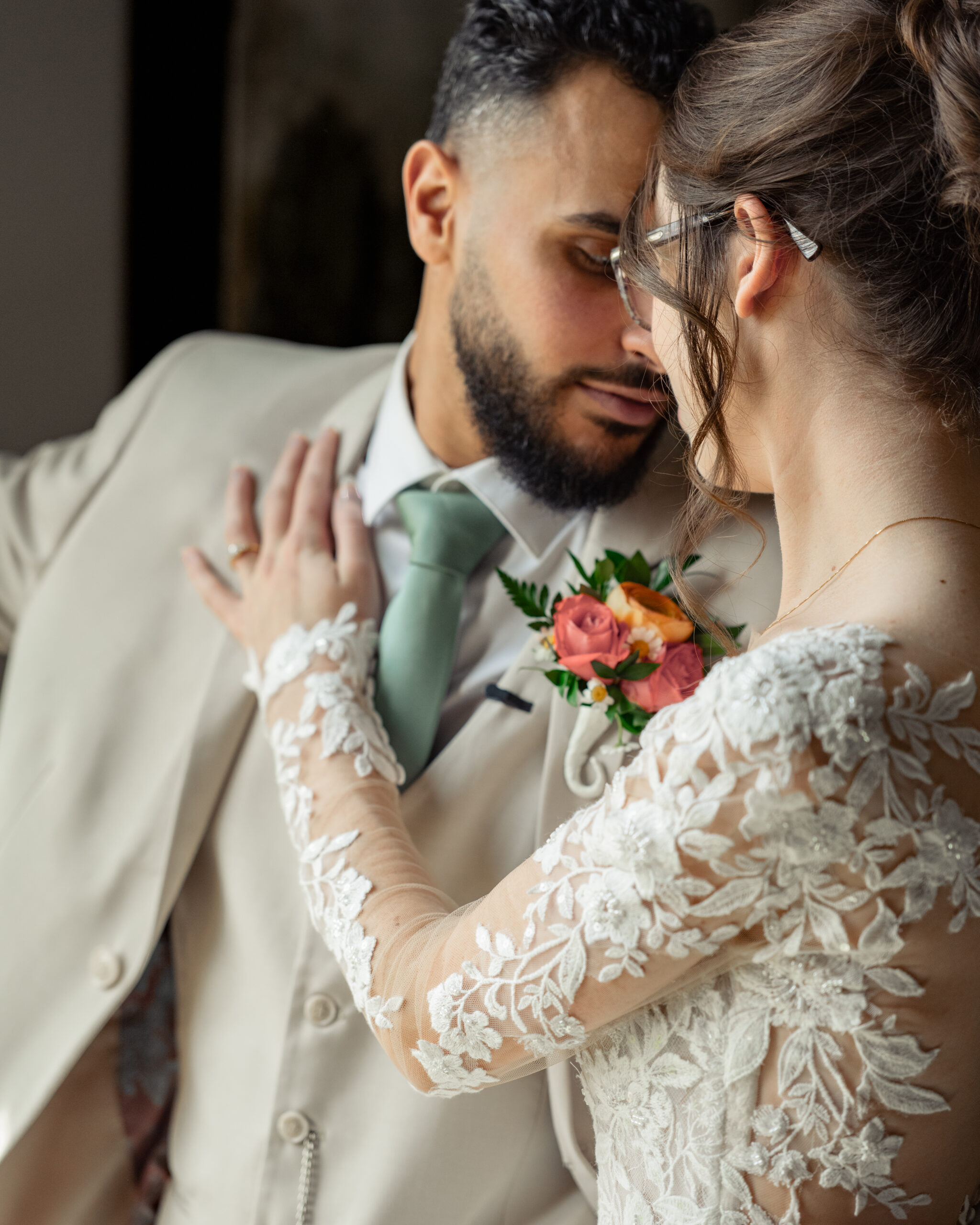A bride and groom share an intimate moment during their first look at Holy Family catholic church in Nashville ahead of their catholic wedding Mass.