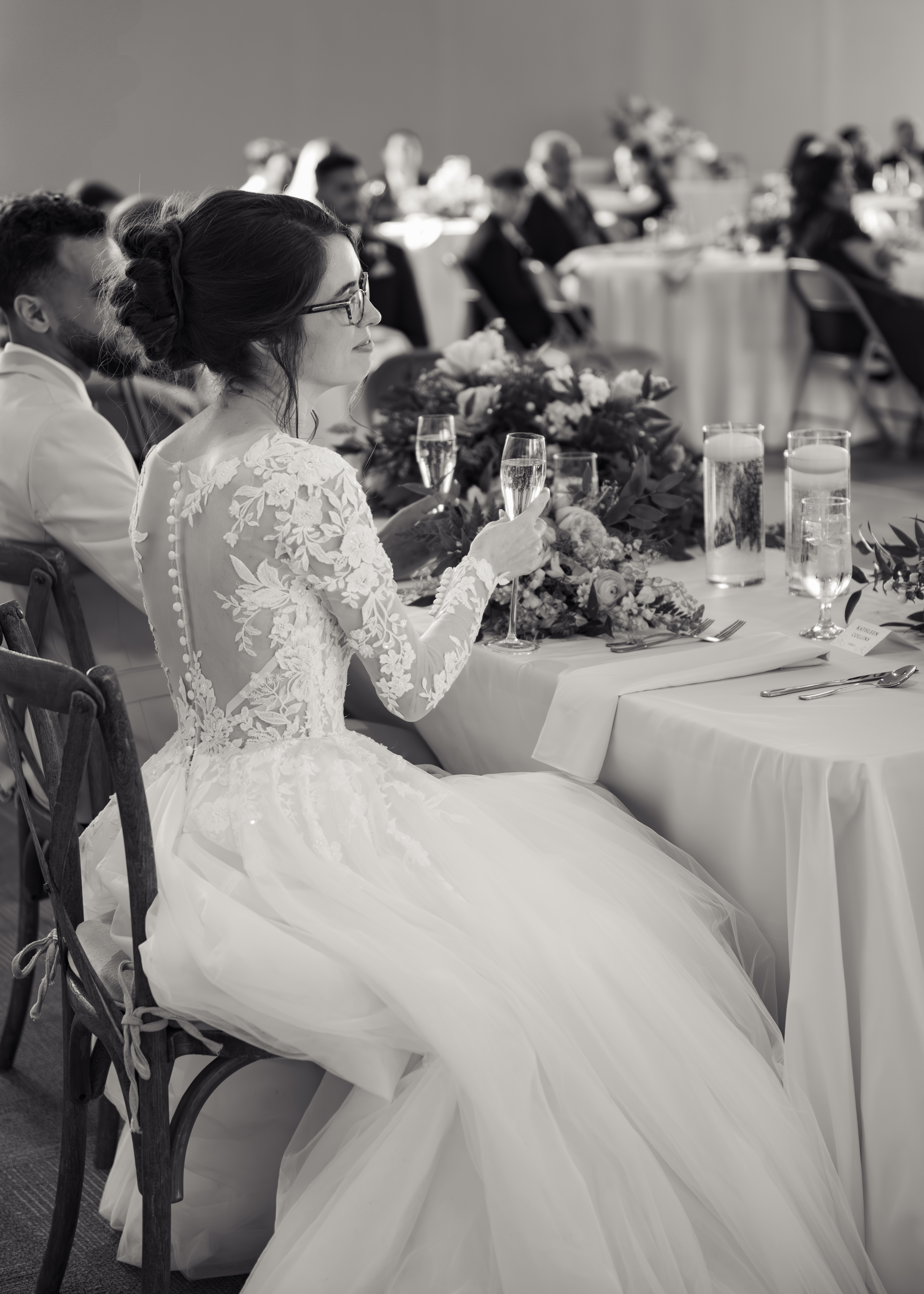 A catholic bride and groom toast with champagne during a catholic wedding reception at holy family catholic church in brentwood, tn