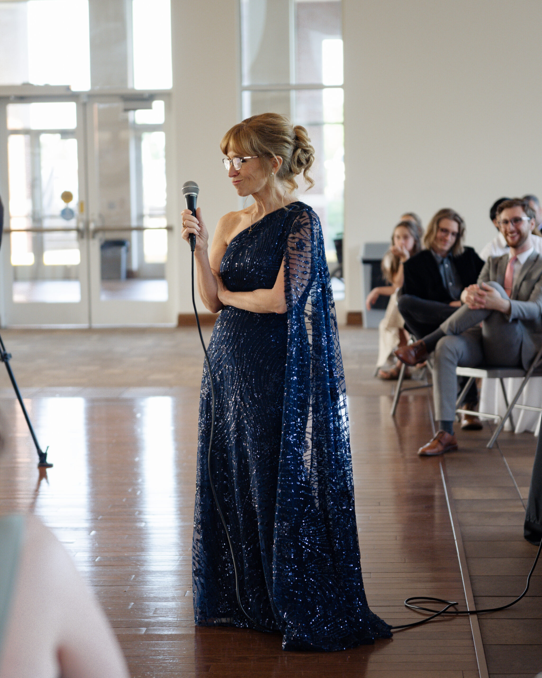 The brides mother gives a speech at a catholic wedding reception at holy family catholic church in brentwood, tn