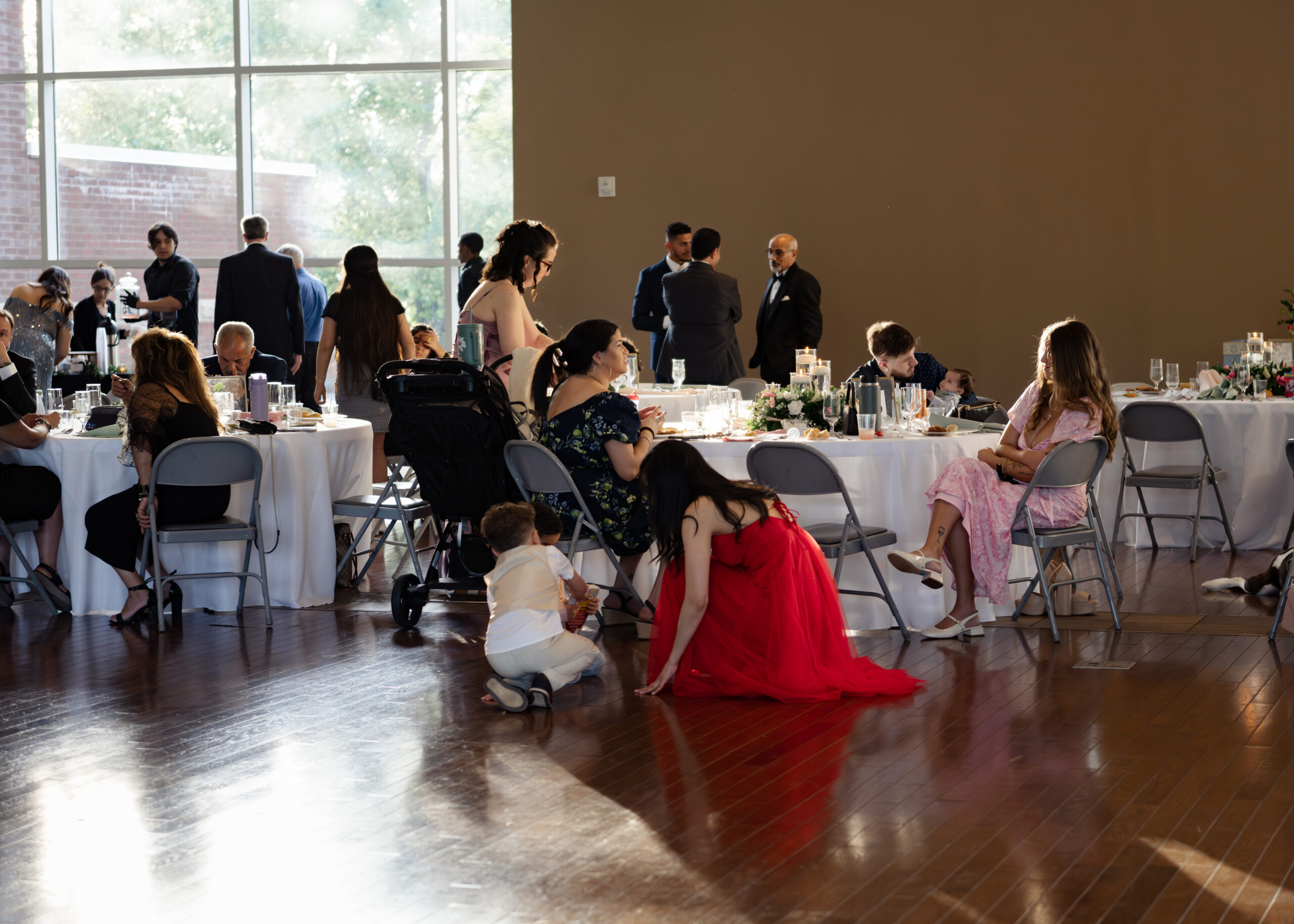 Wedding guests enjoy cocktail hour at a catholic wedding reception at holy family catholic church in brentwood, tn