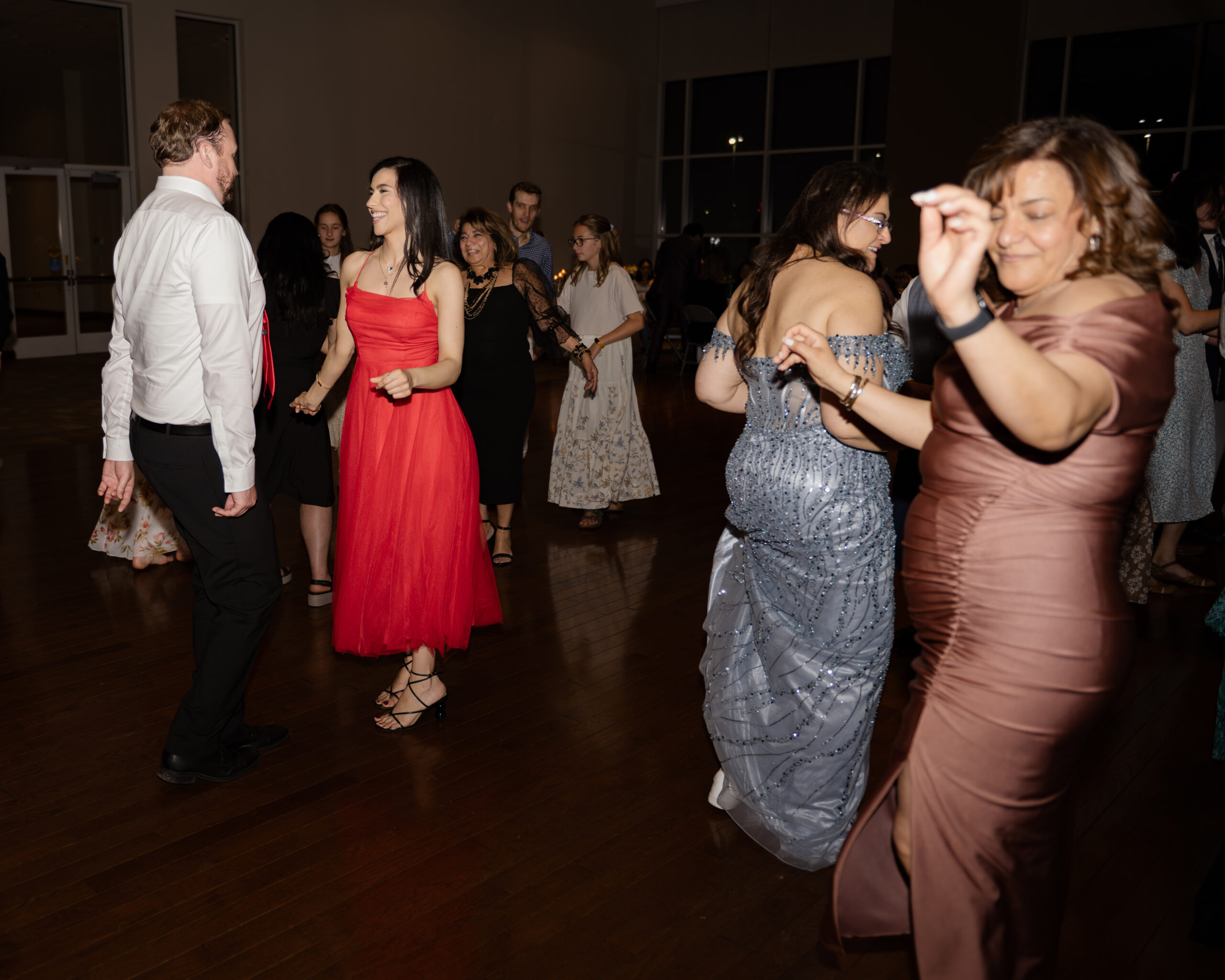 Wedding guests dance at a catholic wedding reception at holy family catholic church in brentwood, tn