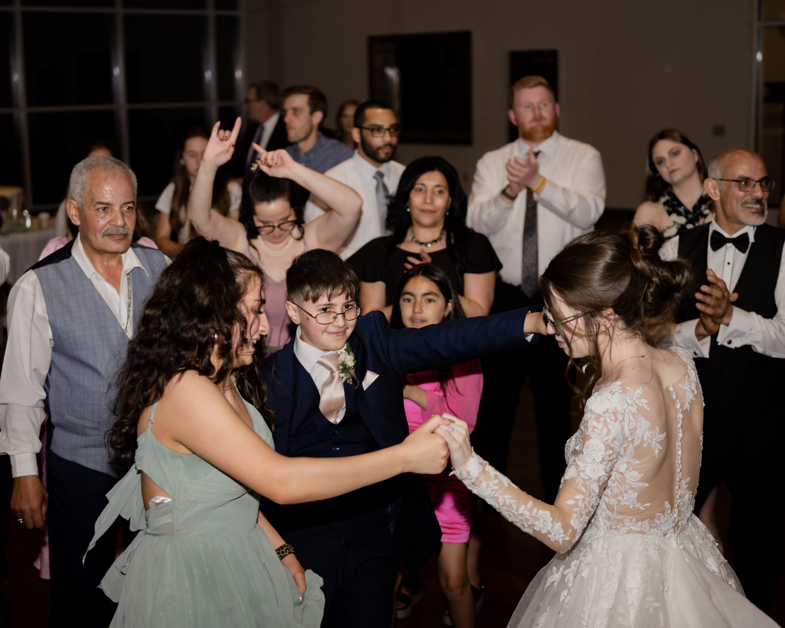 Wedding guests dance at a catholic wedding reception at holy family catholic church in brentwood, tn