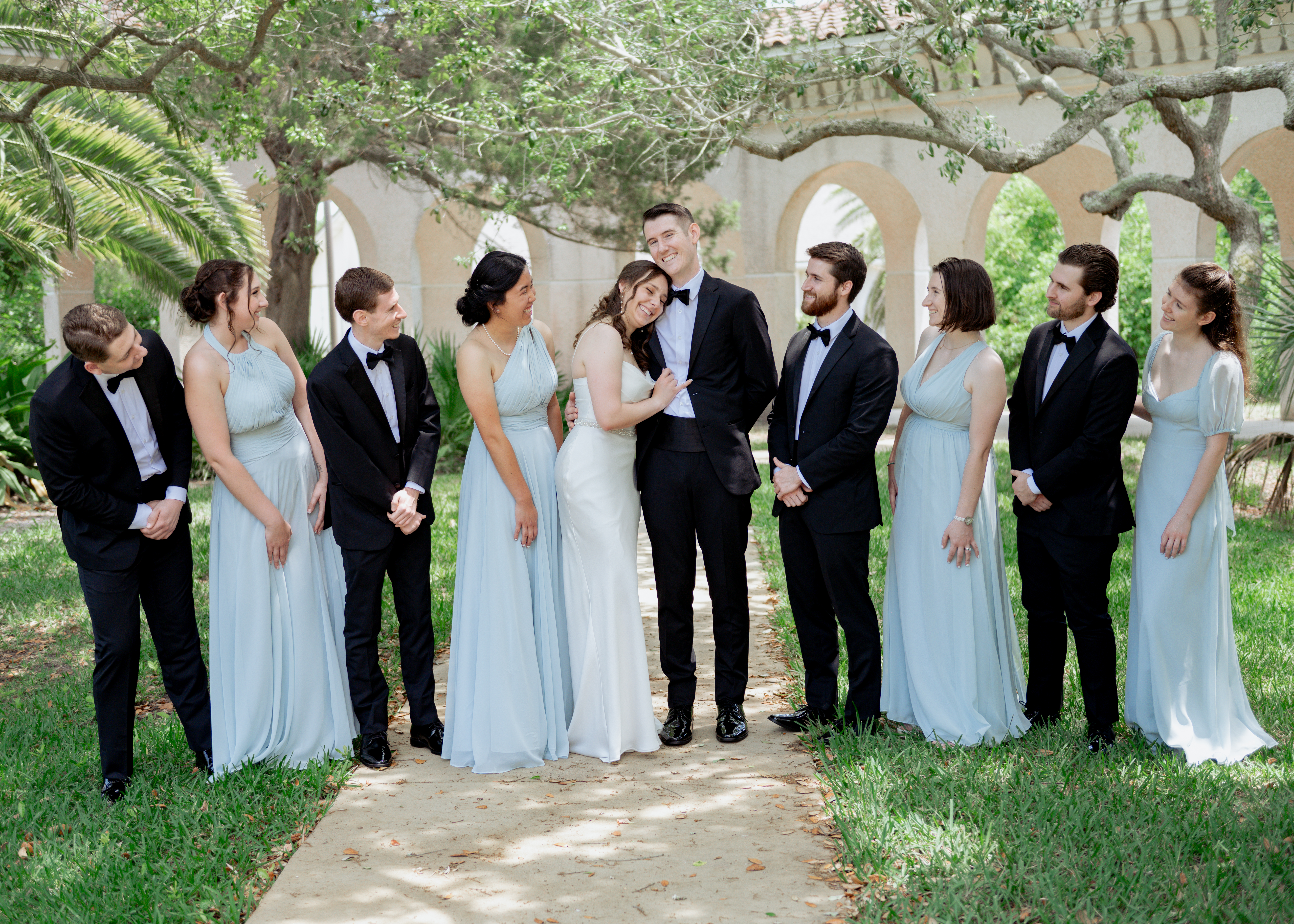 A bridal party poses for a portrait at st. anastasia's catholic church in st. augustine ahead of a catholic wedding mass