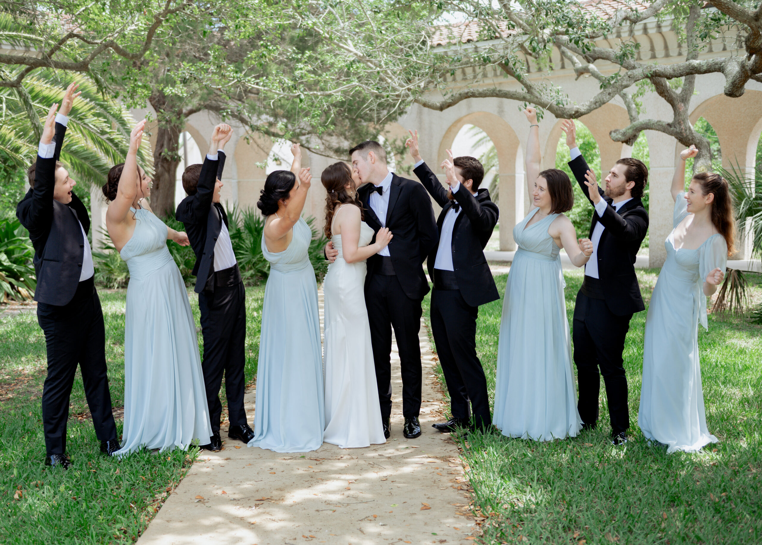 A bridal party poses for a portrait at st. anastasia's catholic church in st. augustine ahead of a catholic wedding mass