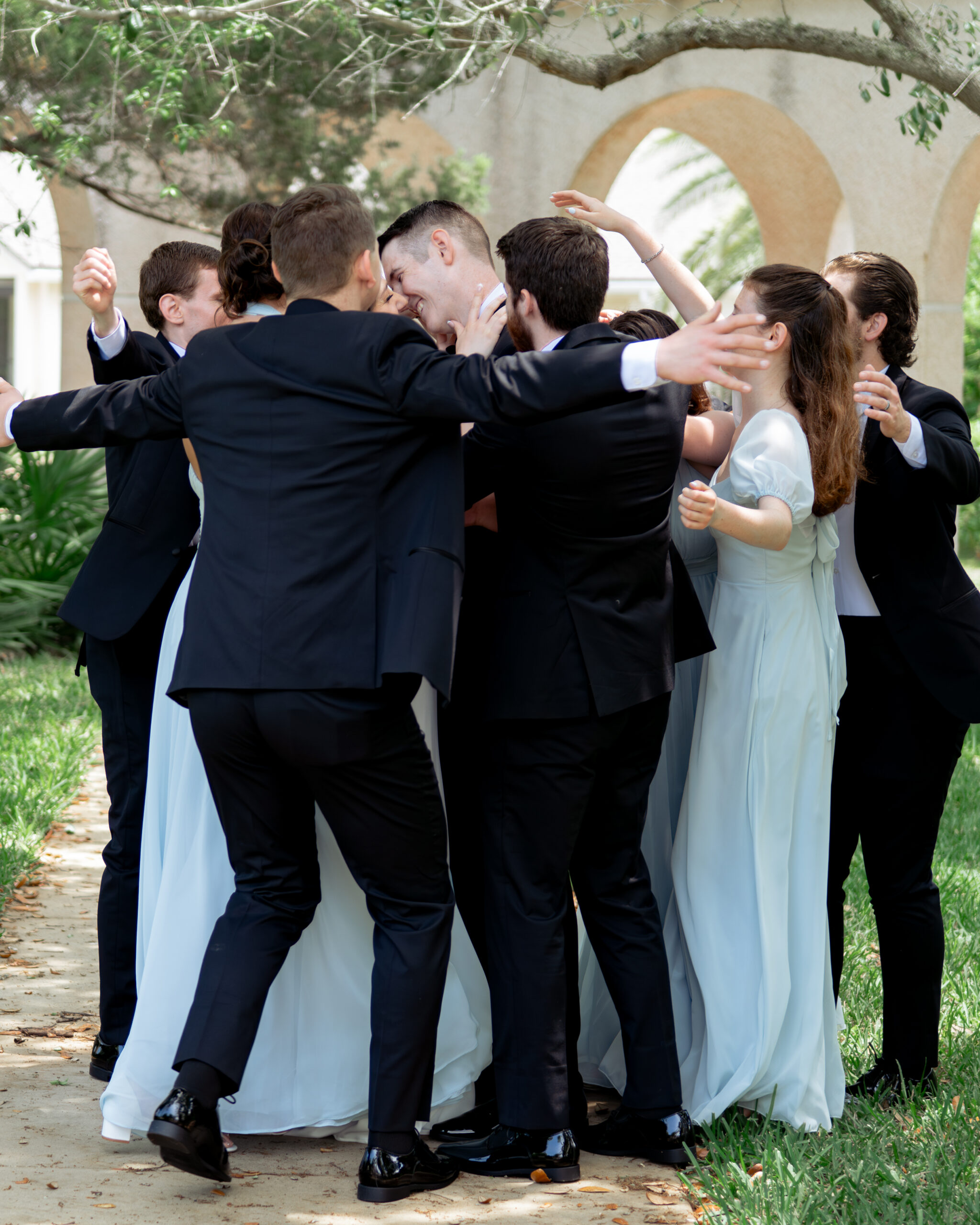 A bridal party poses for a portrait at st. anastasia's catholic church in st. augustine ahead of a catholic wedding mass