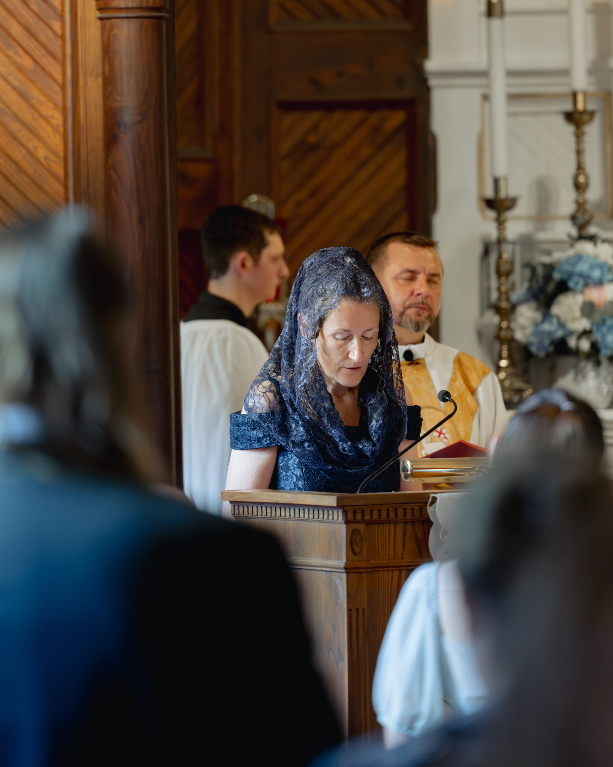 The mother of the groom reads during a catholic wedding mass at st. ambrose Catholic church in st. augustine florida