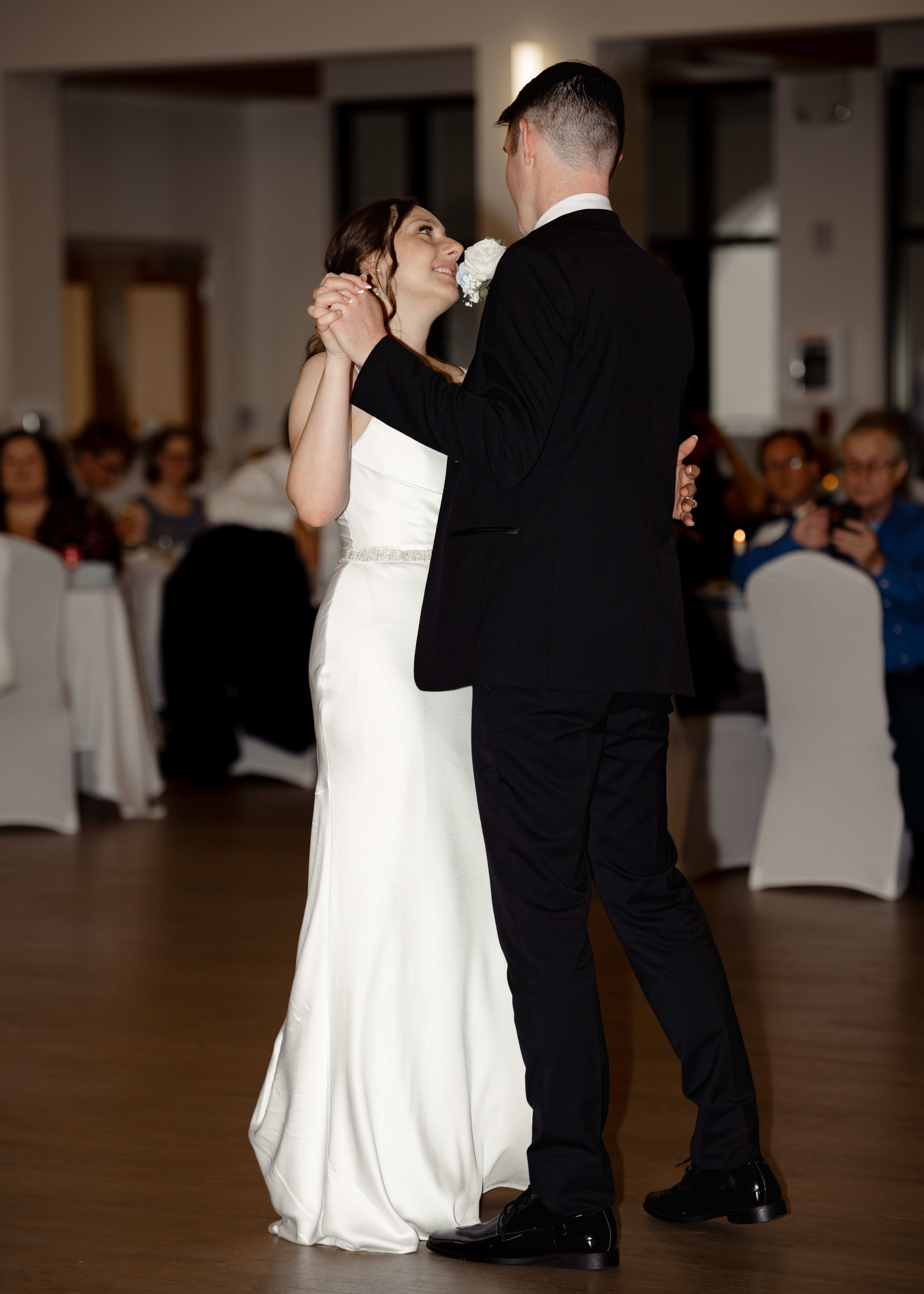 Bride and groom share their romantic first dance during their Catholic wedding reception at St. Anastasia Catholic Church in St. Augustine, Florida.