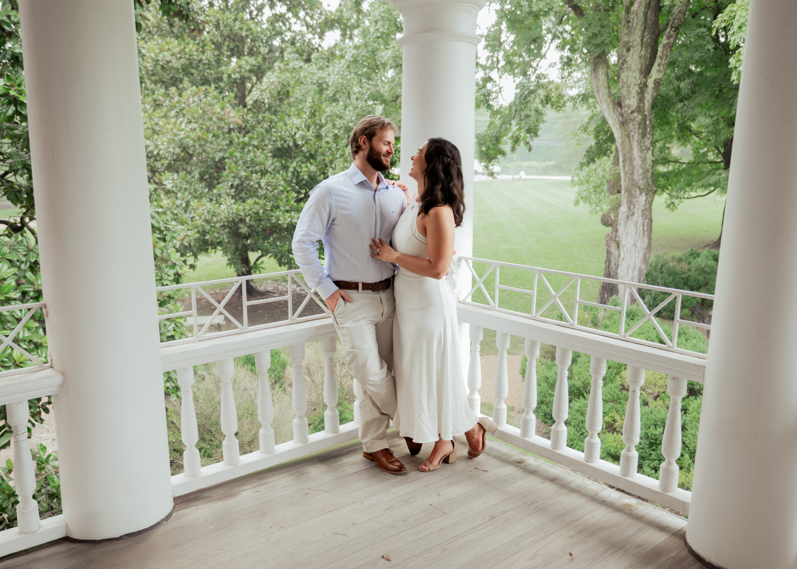 A wide shot shows the historic architecture of a tennessee mansion and the love shared by this catholic couple during their engagement session