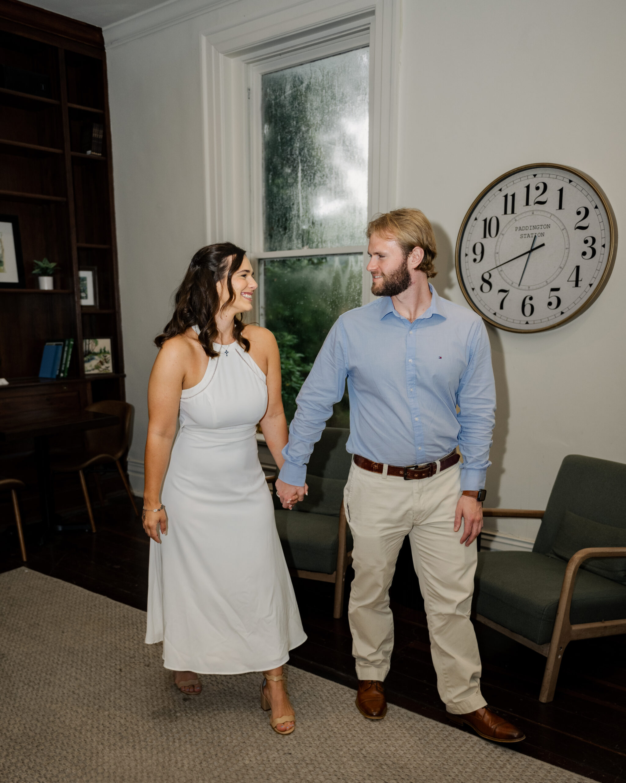 An editorial portrait of a catholic couple in a historic room of a tennessee mansion during their engagement session