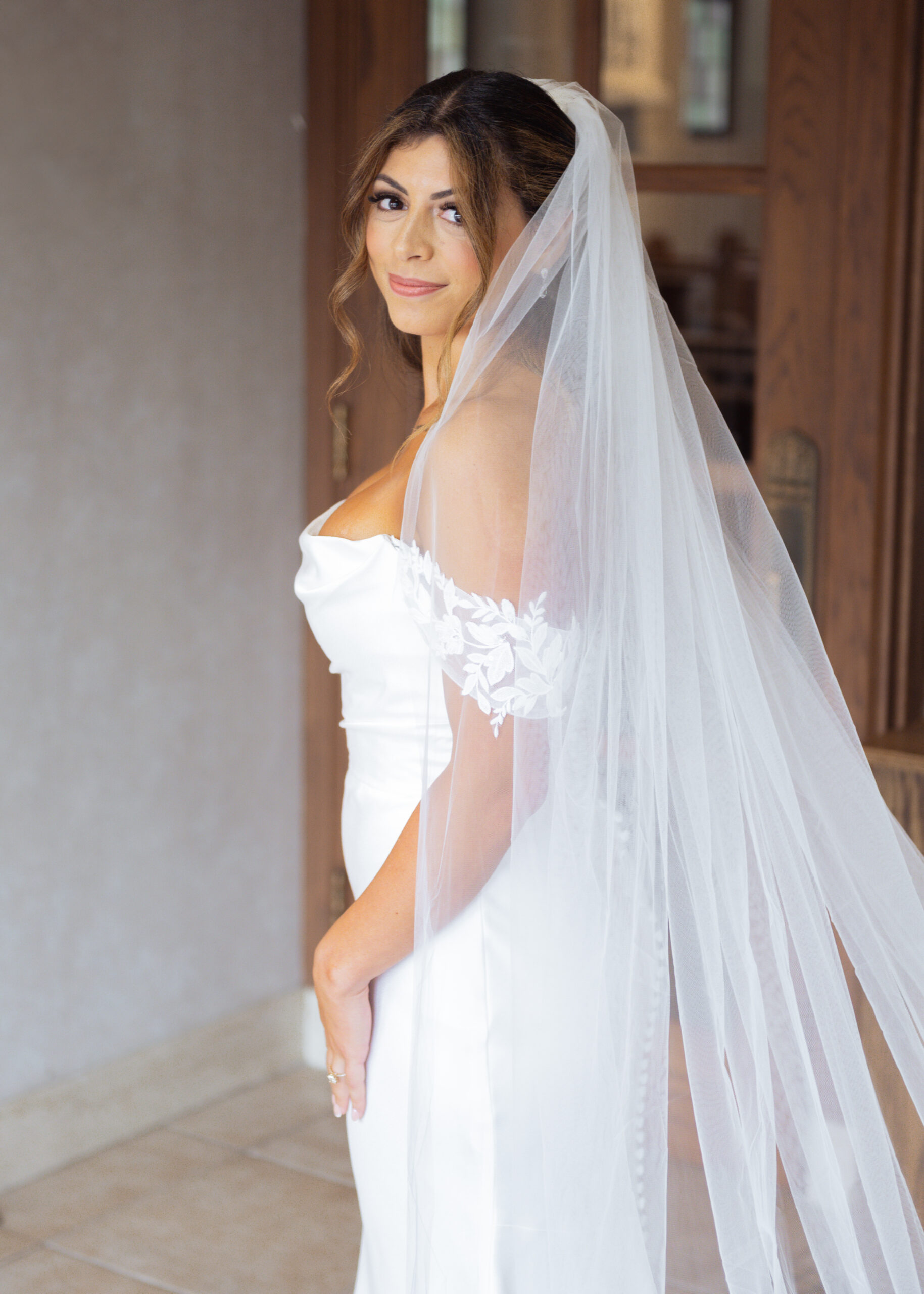A beautiful catholic bride poses for a portrait at St. Ann's Catholic Church in Nashville, TN